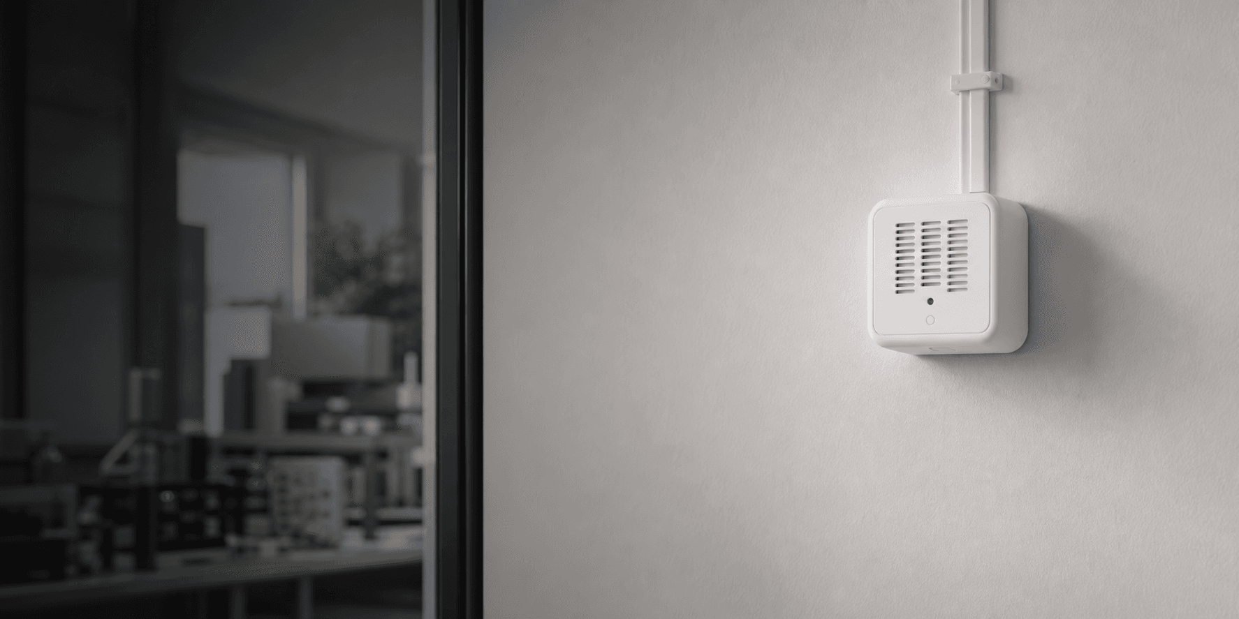 Aeroshi indoor monitor mounted on a light interior wall